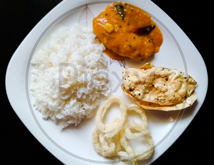 WHITE RICE ,DAL ,PORIYAL,FRYUMS
